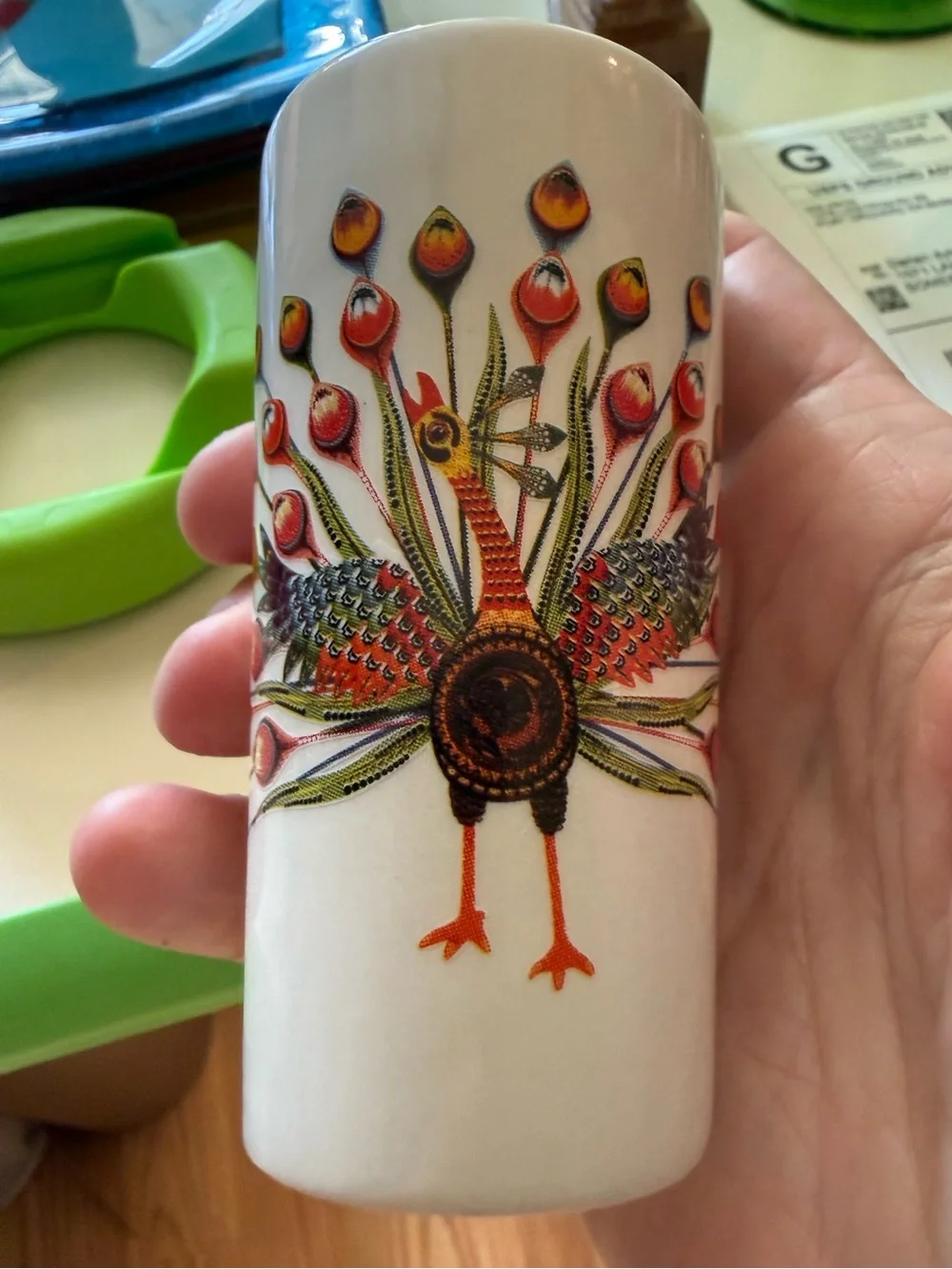 vintage ceramic vase made in Japan in the 1950s features a hand-painted peacock